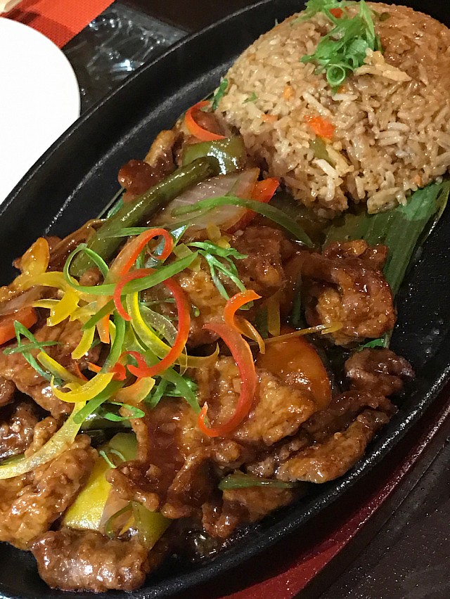 Their signature dish, beef sizzling with a side of fried rice