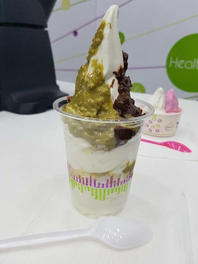 original ice cream with chocolate and pistachio sauce and pineapple